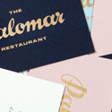 Hand Drawn Typography In Gold Foil On A Business Card For A Restaurant